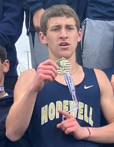 Student Holding Medal