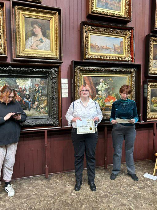 Hopewell Students standing in front of art