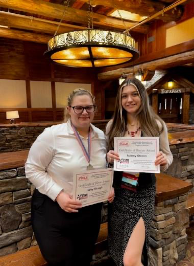 Students at Media Day holding a certificate