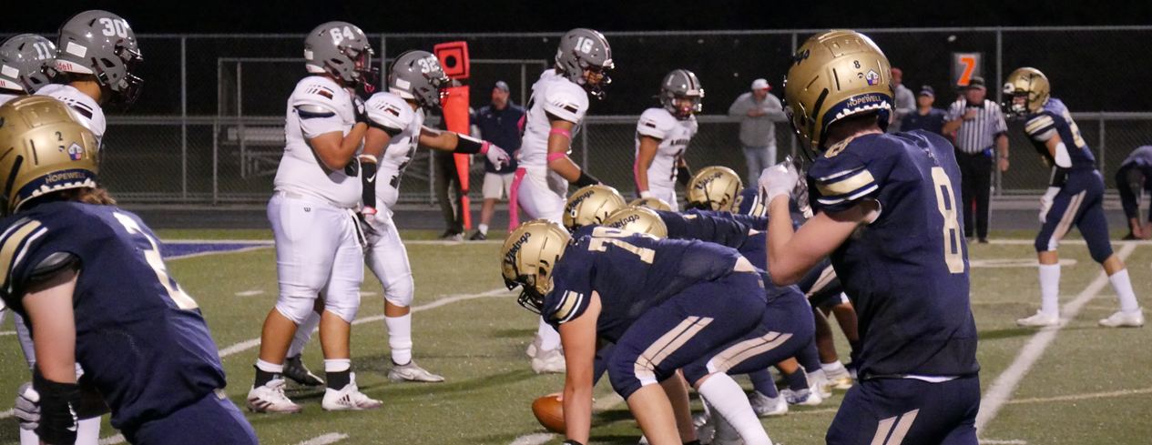 Football players lined up on field